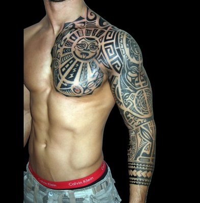 27_tribal-rock-styled-tattoo-on-arm-and-chest_540x550.jpg
